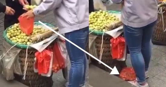 网上流传的短片显示，卖枣子枣子的小贩以偷龙转凤的手段把枣子换掉。(香港《明报》)