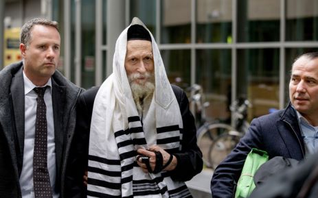 Israeli Rabbi Eliezer Berland (C), who is suspected of sexual abuse in Israel, arrives at court in Haarlem, on 17 November 2014, with his lawyer Louis de Leon (R). Picture: AFP/ANP/Sander Koning.