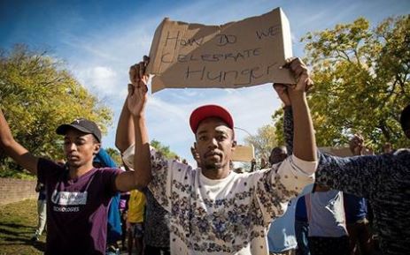 Students make their way, protesting, towards a police barricade. Picture: Thomas Holder/EWN.