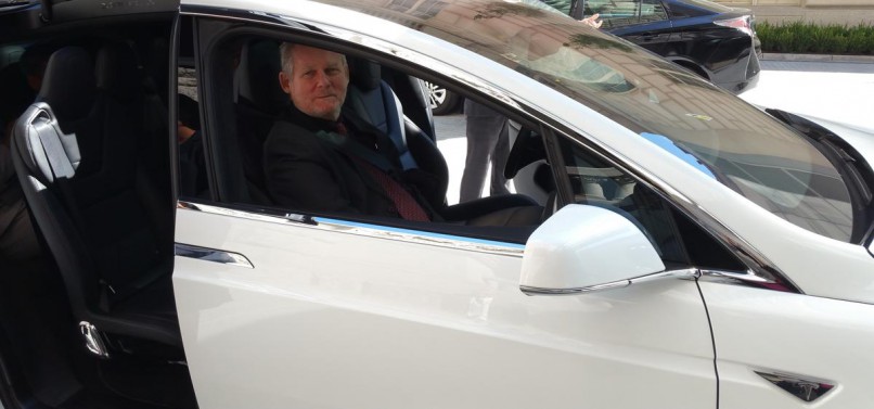 Minister Rob Davies tries out a Tesla in Washington DC. Picture provided by dti.