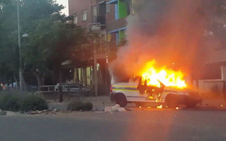 A Police van is on fire in Braamfontein. Picture: Twitter screengrab.