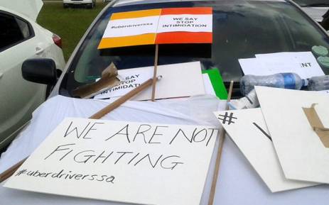 Uber drivers dressed in reflector jackets gathered in Marlboro where they made posters with anti-violence slogans on 11 February 2017. Picture: Queenin Masuabi/EWN.