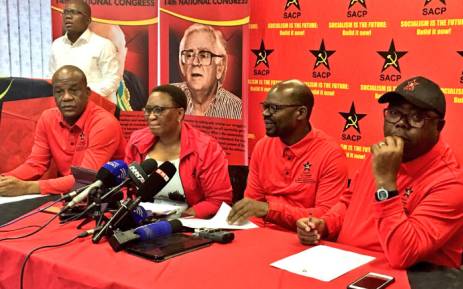 SACP's Solly Mapaila (second right) and party members addressing the media after President Jacob Zuma announced changes to his Cabinet on 17 October 2017. Picture: Katleho Sekhotho/EWN.