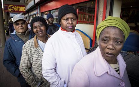 FILE: Pensioners queue outside of a supermarket in Mitchells Plain on the 1st of the month to collect their Sassa grants. Picture: Thomas Holder/EWN