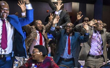 Zimbabwe's members of parliament celebrate after Mugabe's resignation on 21 November 2017 in Harare. Picture: Jekesai Njikizana/AFP