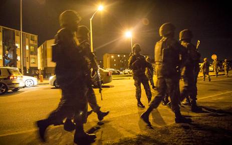 FILE: Members of the SANDF gather outside a blocks of flats in a known gang area in Ottery, Cape Town, during a Fiela Operation conducted during the early hours of the morning. Picture: Thomas Holder/EWN