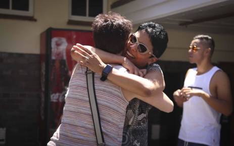 The mother of a Westerford Matric pupil, Estelle Cloete hugs another mother at the school. The school achieved a 100% pass rate. Picture: Cindy Archillies/EWN