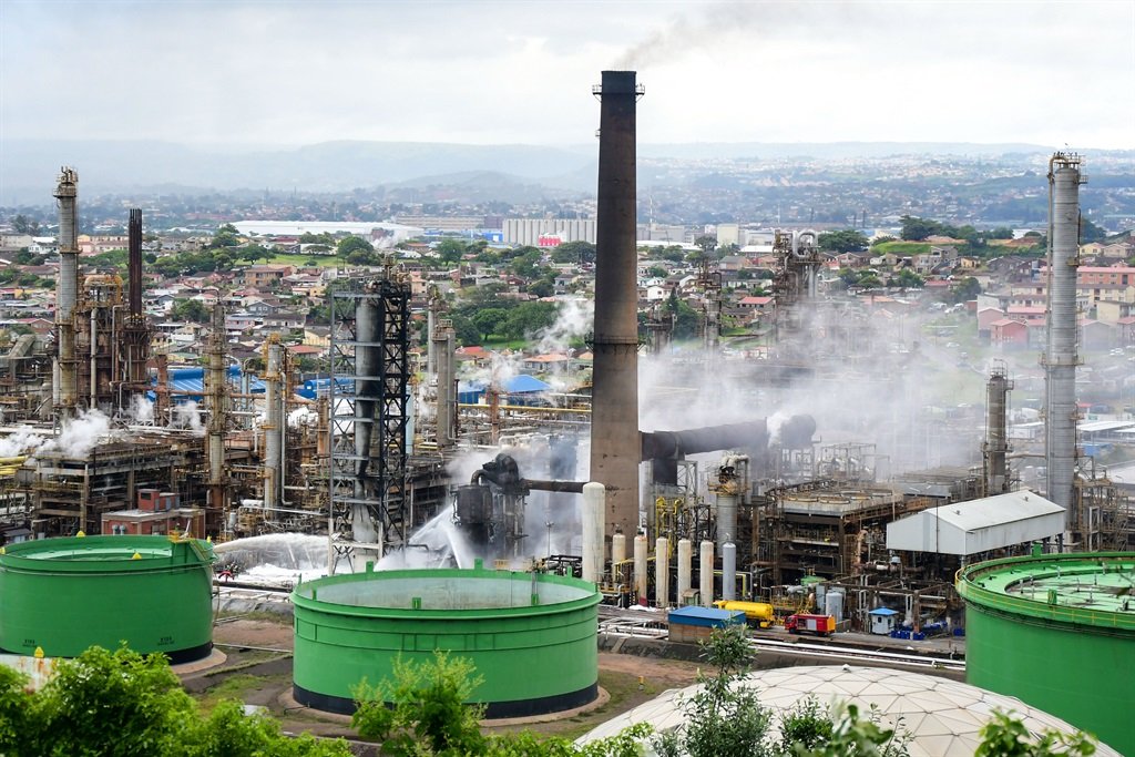 Firefighters work to keep the fire out at Engen Oil Refinery. (Darren Stewart, Gallo Images)