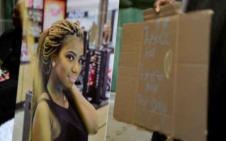 A mourner holds a placard demanding justice for Tshegofatso Pule at her funeral in Meadowlands, Soweto. The murdered 28-year-old was laid to rest on 11 June 2020. Picture: Kayleen Morgan/EWN